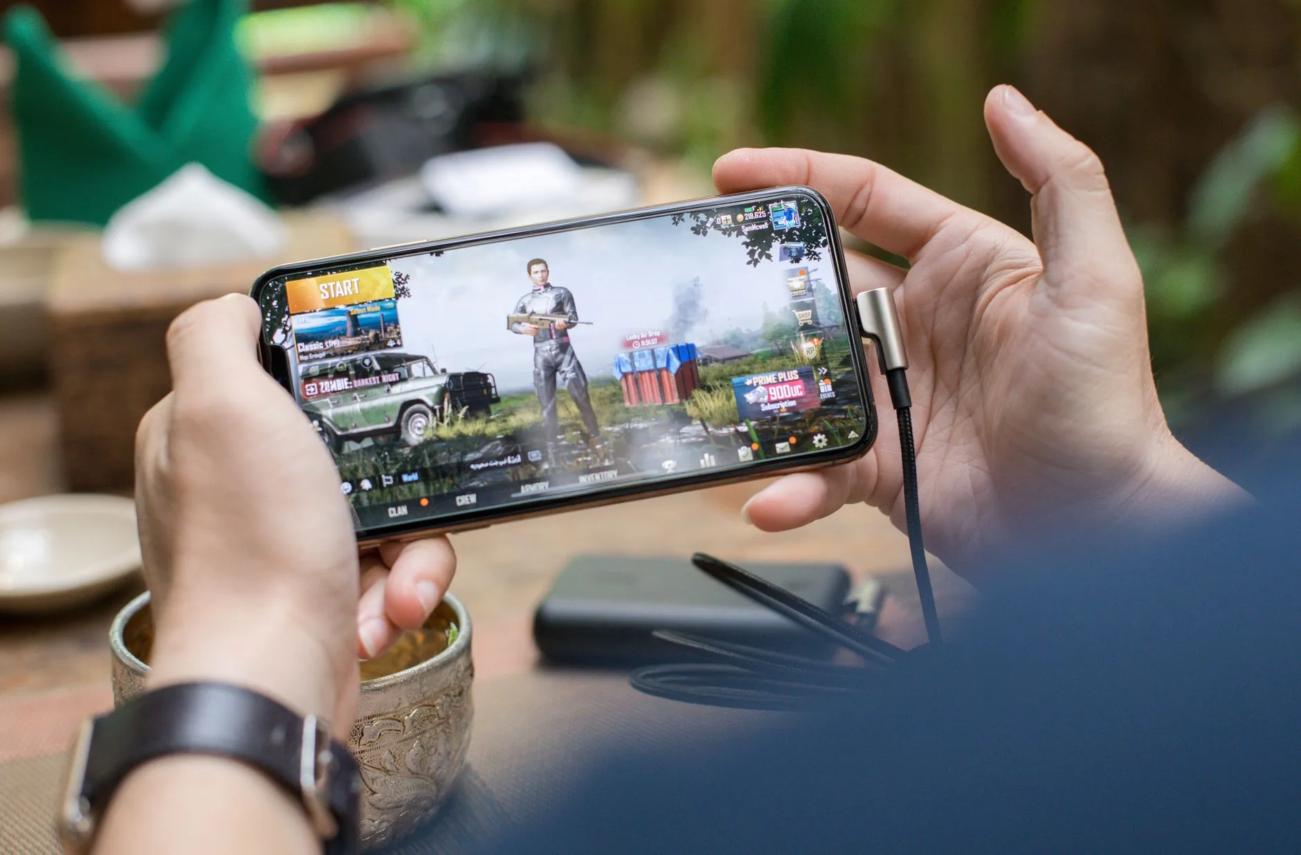 A person playing a fast-paced game on a smartphone